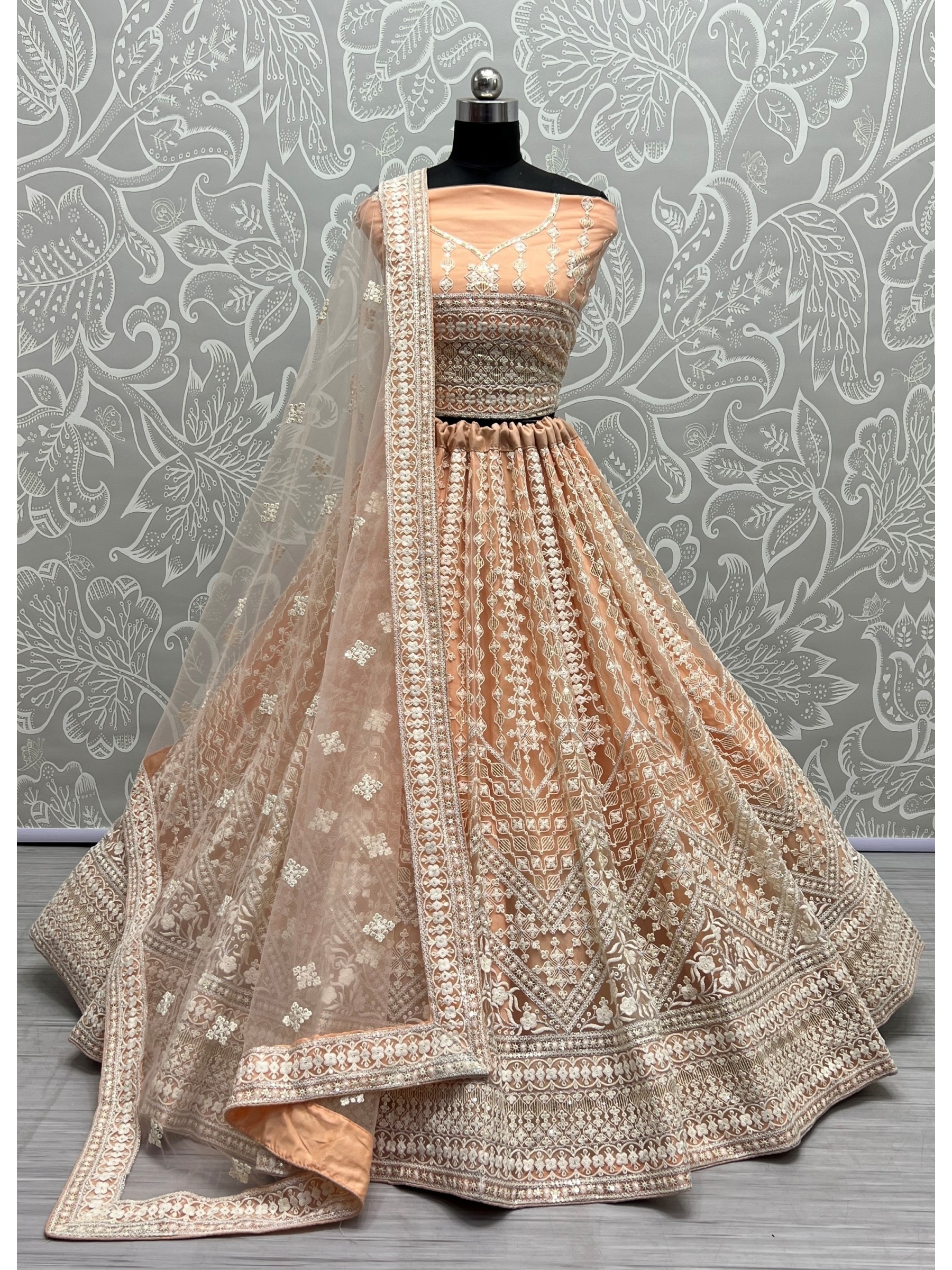 Soft Premium Net Wedding Wear Lehenga In Peach Color  With Embroidery Work