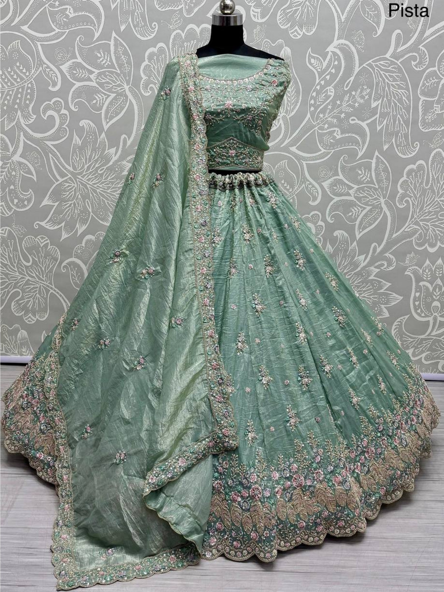 Pure Silk Crush Fabric Wedding Wear Lehenga In Pista Color With Embroidery Work