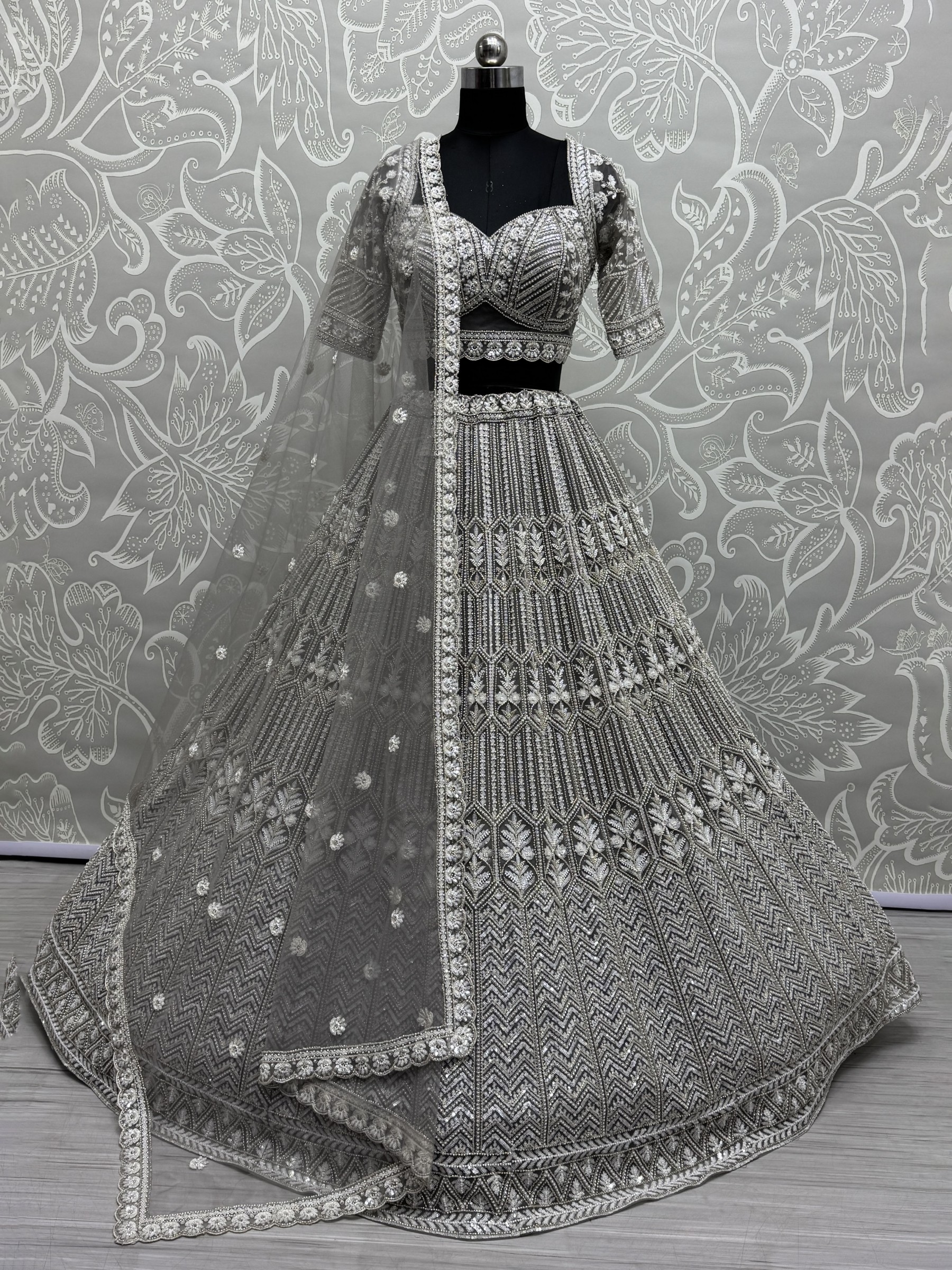 Soft Premium Net Fabric Wedding Wear Lehenga In Stone Grey Color With Embroidery Work