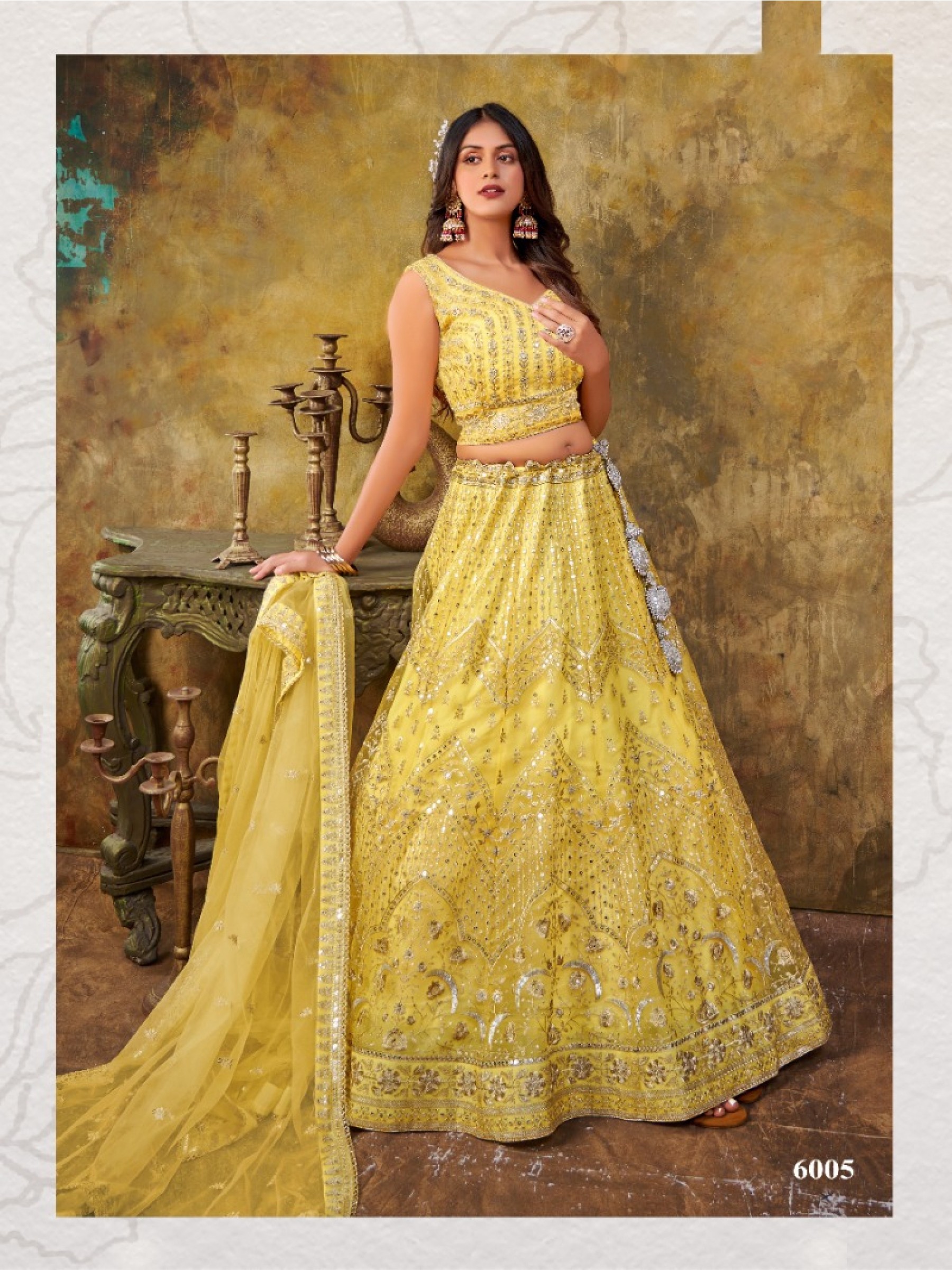 Soft Premium Net Party Wear Wear Lehenga In Yellow With Embroidery Work 