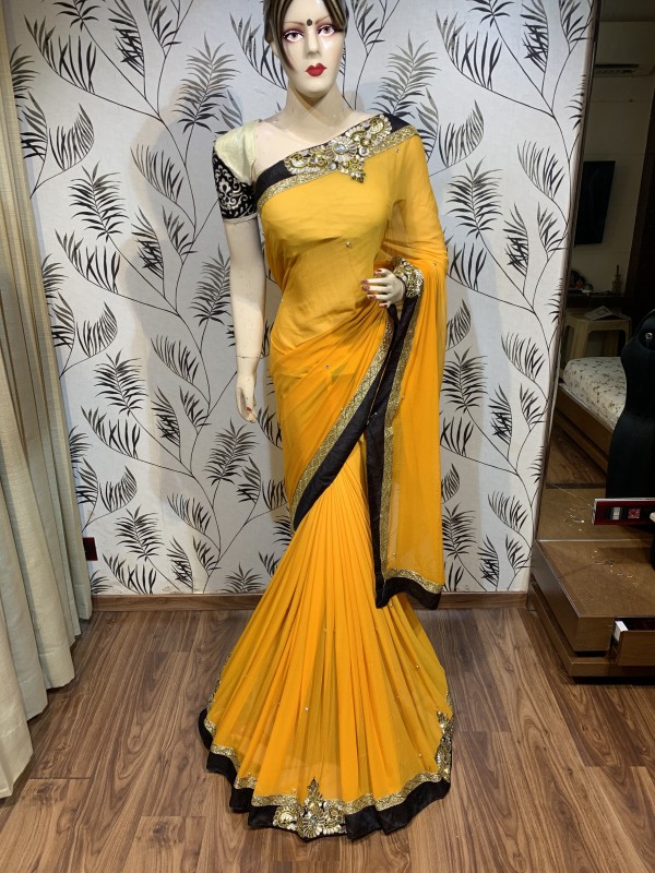 Georgette Fabrics Party Wear Saree In Yellow With Embroidery & Crystal Stone Work