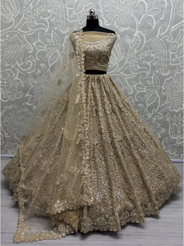 Soft Premium Net Fabric Wedding Wear Lehenga In Golden Color With Embroidery Work