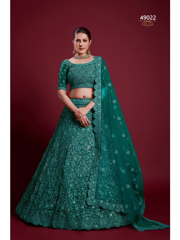 Soft Premium Net Wedding Wear Wear Lehenga In Teal Green Color With Embroidery Work 
