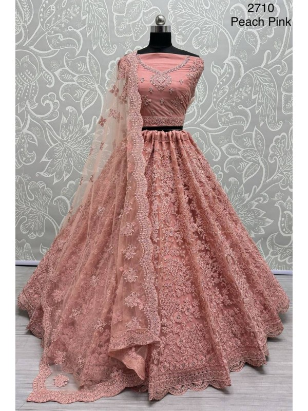 Soft Premium Net Wedding Wear Lehenga In Peach Color  With Embroidery Work