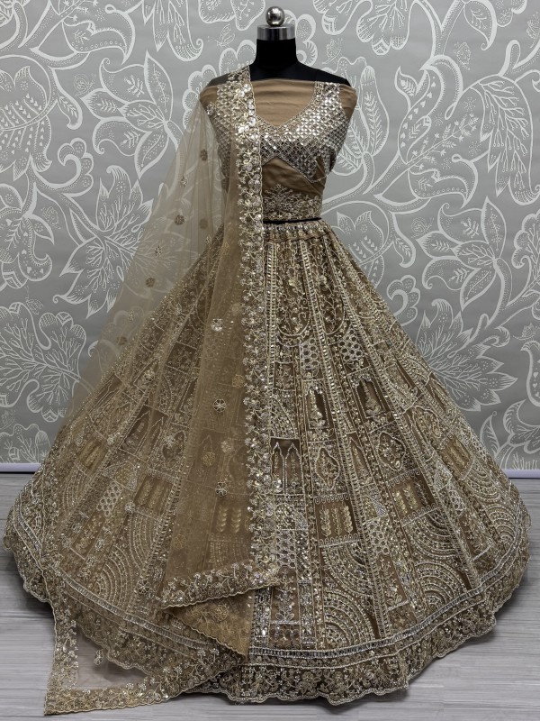 Soft Premium Net Fabric Wedding Wear Lehenga In Golden Color With Embroidery Work